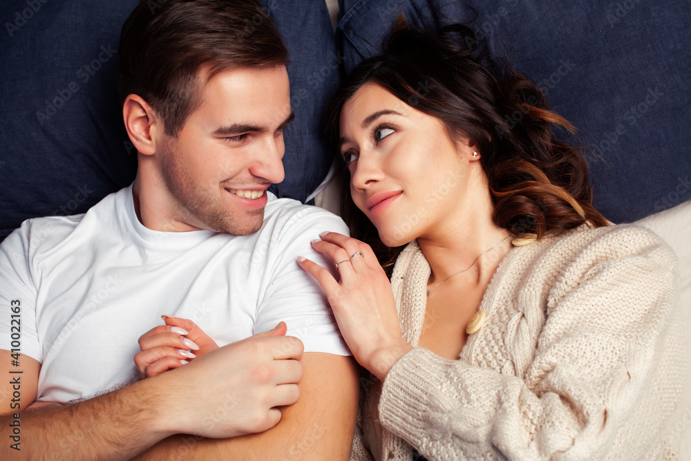 young pretty couple together in bed sleeping chill, lifestyle people concept young pretty couple together in bed sleeping chill, lifestyle people concept