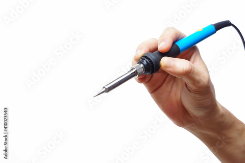 Hand holding a soldering tool isolated on white background