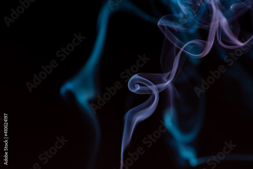 random shapes of colored smoke fired with colored flash
