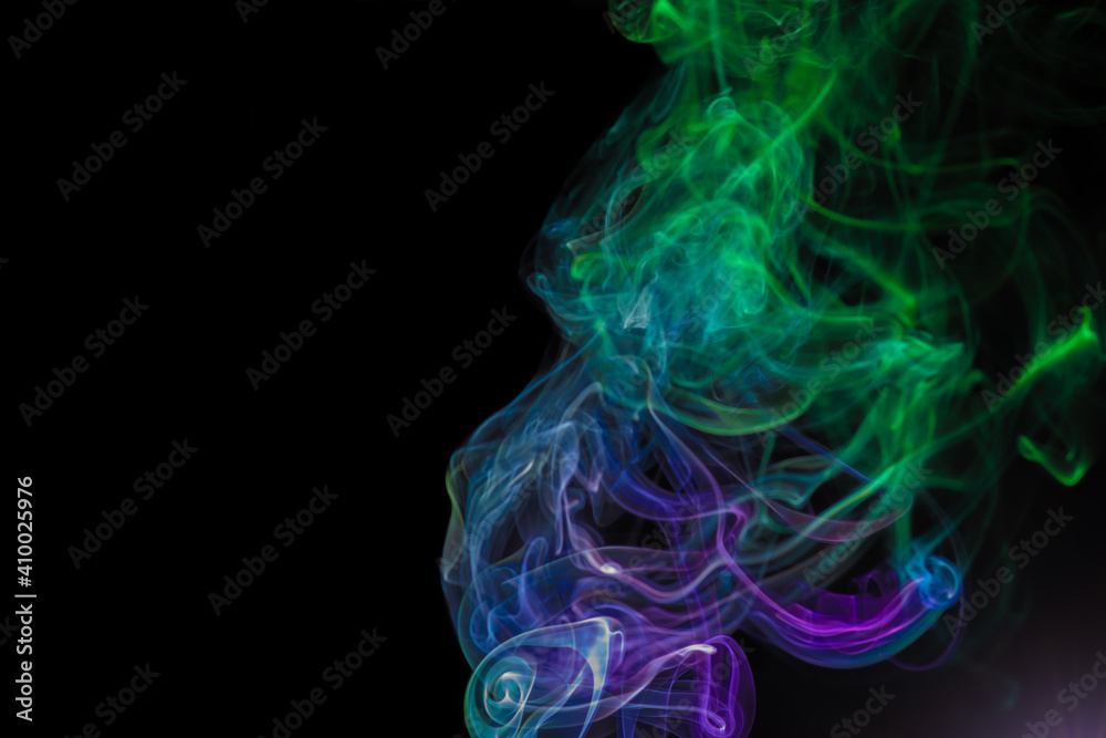 random shapes of colored smoke fired with colored flash