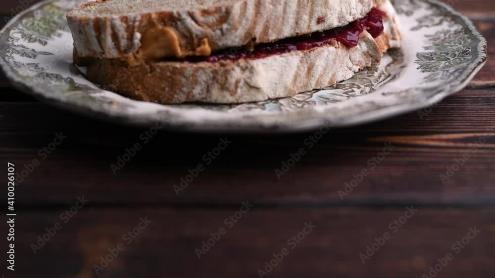 Natural peanut butter and homemade jam / jelly sandwich on artisan multi grain bread.