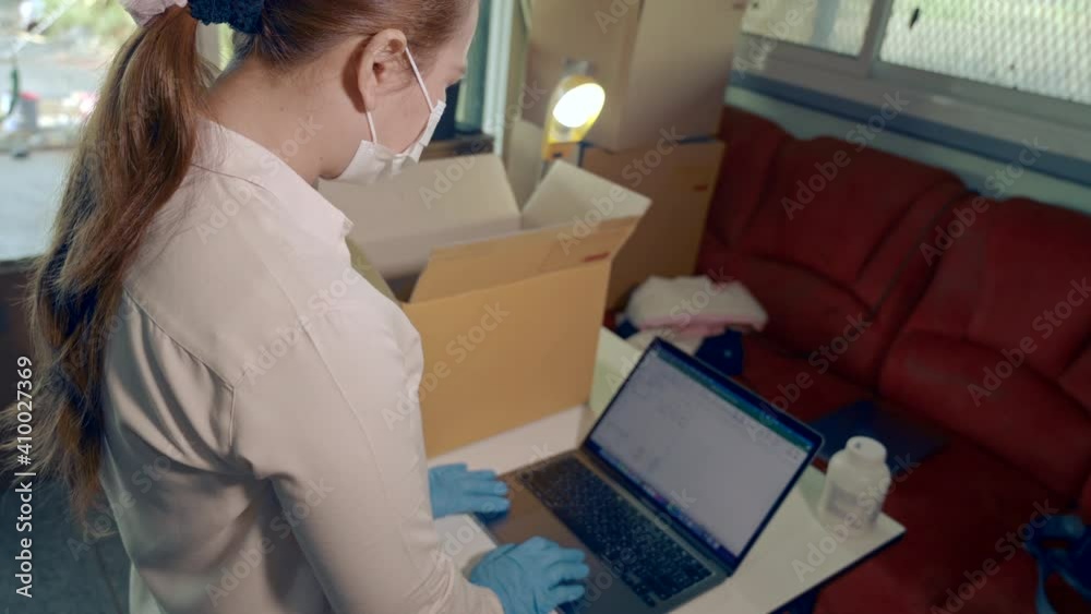 Business woman packing with protective mask Business woman packing with protective mask