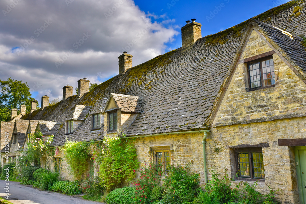 Traditional rural houses in Bibury, a village in Cotswolds area, England, UK Traditional rural houses in Bibury, a village in Cotswolds area, England, UK