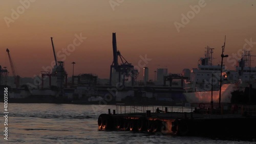 Sunset or dawn time moving by an importing-exporting coast smoothly Bosphorus photo