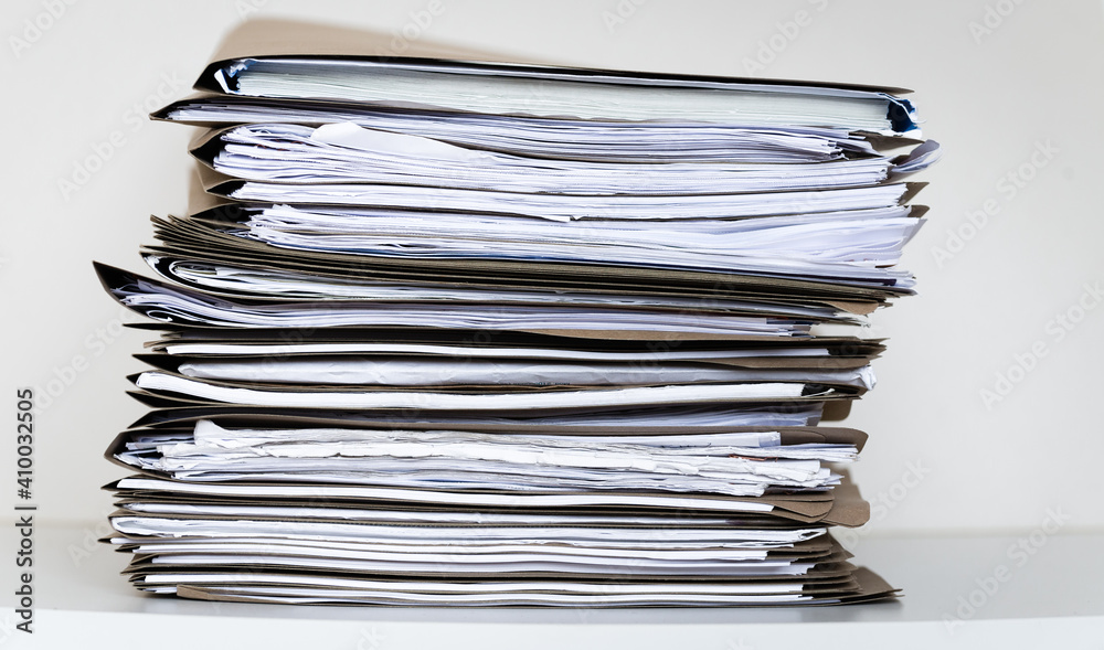 Extremely Close up Stack of Documents Folders on Office Desk Waiting to be Completed. Extremely Close up Stack of Documents Folders on Office Desk Waiting to be Completed.