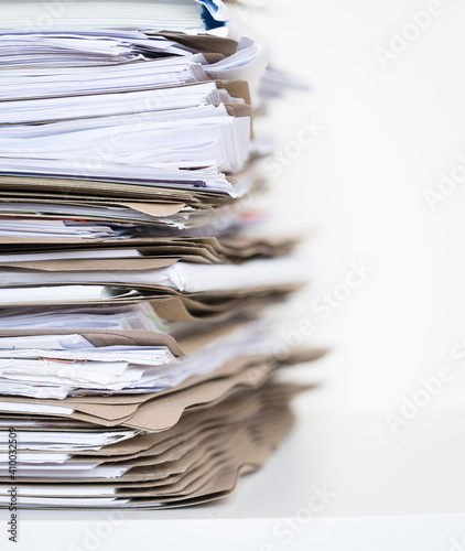 Extremely Close up Stack of Documents Folders on Office Desk Waiting to be Completed.