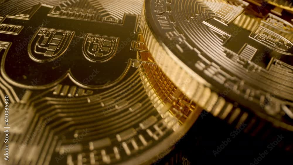 Bitcoins spinning around against black Bitcoins spinning around against black