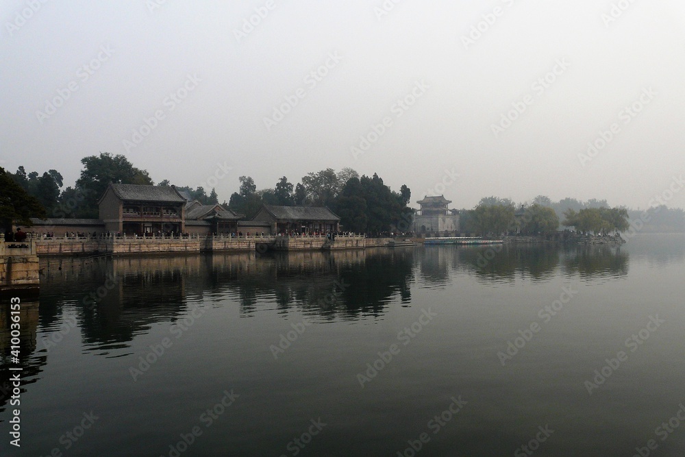 Reflection in the lake of the Summer Palace on a foggy day, Beijing