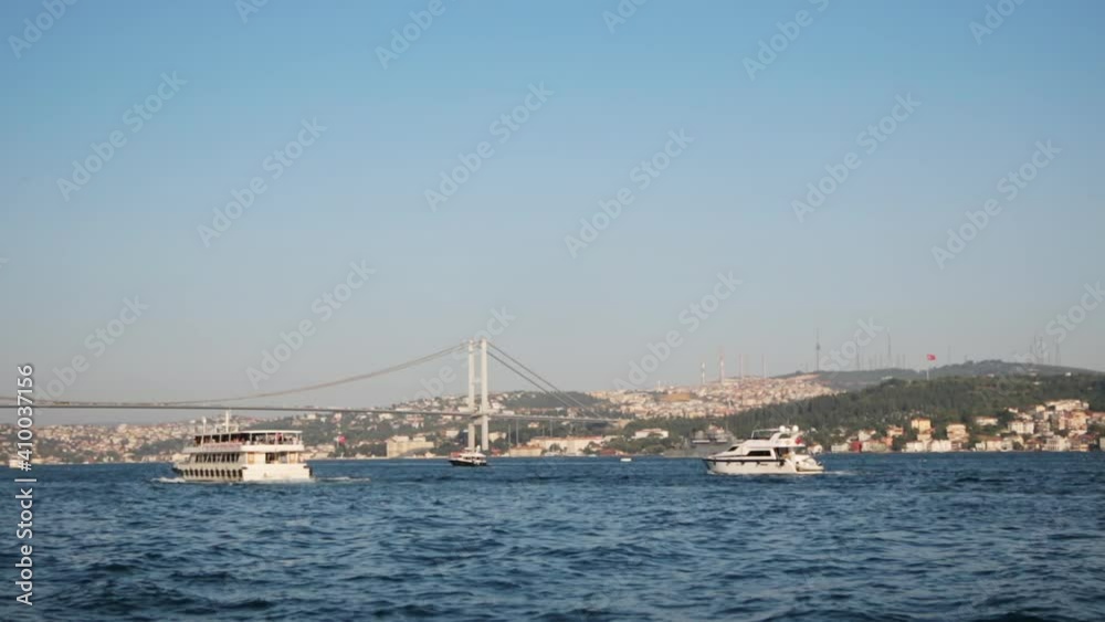Cityscape of Bosphorus with Marmara Sea and Iconic Bridge of Istanbul City between Asia and Europe Continents with Ships on Blue Water Cityscape of Bosphorus with Marmara Sea and Iconic Bridge of Istanbul City between Asia and Europe Continents with Ships on Blue Water