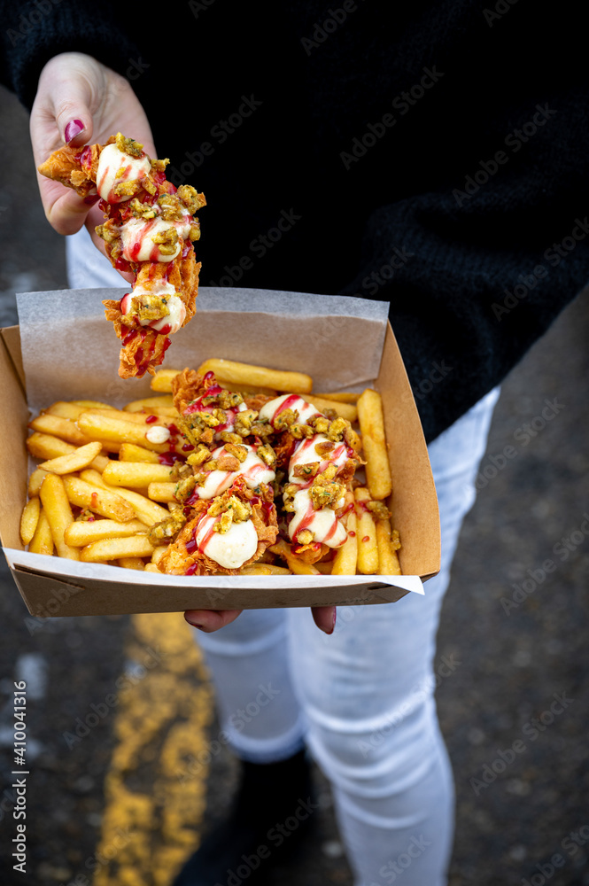 Korean fried chicken tender with spicy chips and sauce Korean fried chicken tender with spicy chips and sauce
