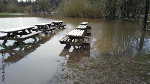 River Bollin in Wilmslow, Cheshire, England, UK after heavy rainfall and bursting its banks . photo