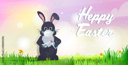 rabbit in mask applying antibacterial spray to prevent covid-19 virus spreading happy easter spring holiday coronavirus pandemic concept landscape background horizontal greeting card lettering vector