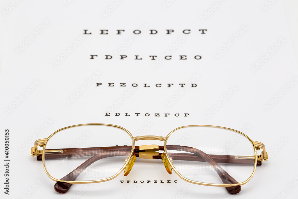 Glasses are on the table for an eye test. Glasses are on the table for an eye test.
