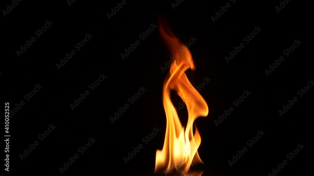 Slow motion closeup campfire burn on black background, fire flame design element Slow motion closeup campfire burn on black background, fire flame design element