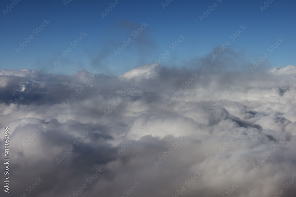 Beautiful View of the Cloudscape over the Canadian Mountain Landscape during a sunny and cloudy winter day. Taken in Whistler, BC, Canada. Good for Background, Backdrop