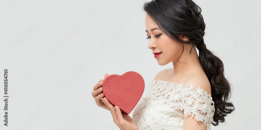 Young happy woman with a gift. Concept of the New Year, Christmas and Valentine's Day. Young happy woman with a gift. Concept of the New Year, Christmas and Valentine's Day.