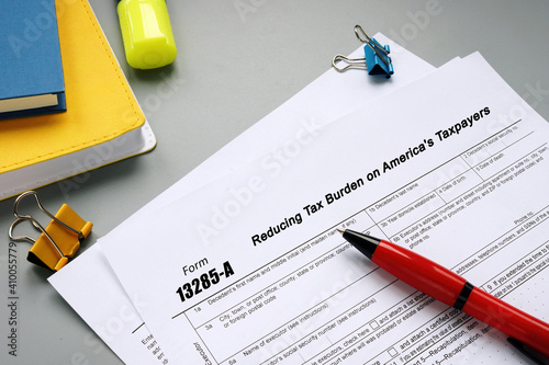 Business concept meaning Form 13285-A Reducing Tax Burden on America's Taxpayers with phrase on the sheet.