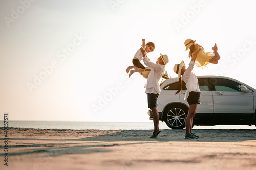 Asian family vacation holiday,Happy family, parents holding children flying in the sky.Concept family and Holiday and travel.