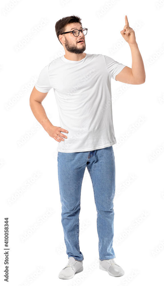 Fototapeta premium Portrait of young man showing something on white background