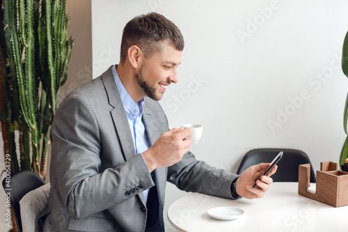 Handsome man with mobile ph...