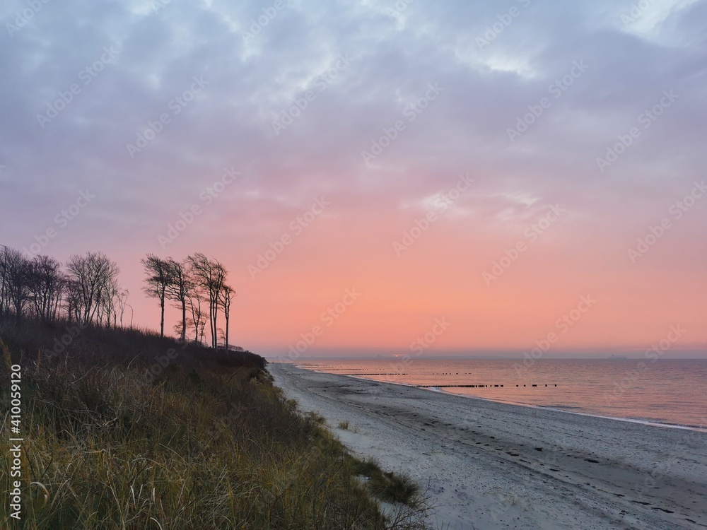 Sunset at a natural beach at the Baltic Sea in Germany, close to the city oft Rostock