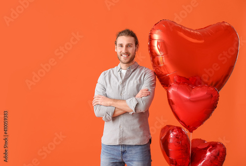 Young man with air balloons...