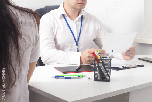 A male gynecologist doctor examines a woman s hormone test results. The concept of female libido, hypersexuality, satisfaction