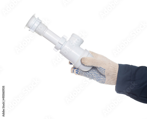 Billede på lærred Plumber holding a drain siphon on a white background, isolate, close-up