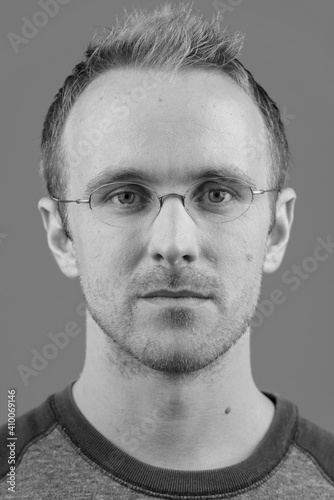 Face of handsome man with eyeglasses against white background