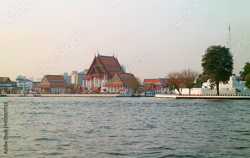 Wat Kalayanamitr Buddhist Temple and the White Ramparts of Vichai Prasit Fort on Chao Phraya River Bank, Bangkok, Thailand photo