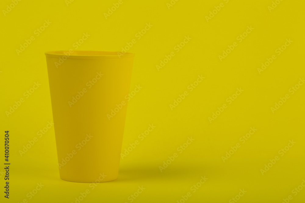 Yellow glass on a yellow background close-up. Yellow glass on a yellow background close-up.
