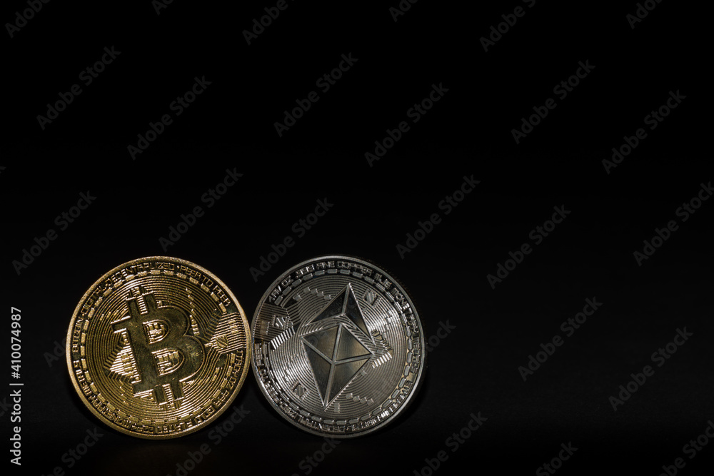 single bitcoin and ether coin with black background left single bitcoin and ether coin with black background left