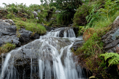 Water flowing in a small creek. Nature background.