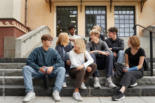 Teenagers in front of school photo