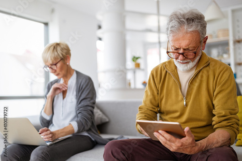 Senior couple having problems with technology devices at home