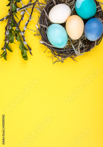 Colorful background with Easter eggs on yellow background. Happy Easter concept. Can be used as poster, background, holiday card