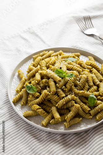 Homemade Pesto Twist Pasta on a plate, low angle view.
