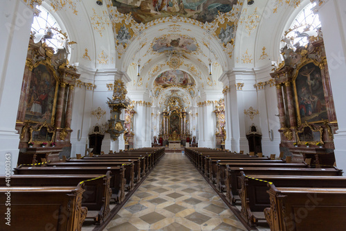 View along the main aisle of the church of Schäftlarn Abbey towards the altar. Interior of a typical upper bavarian church.