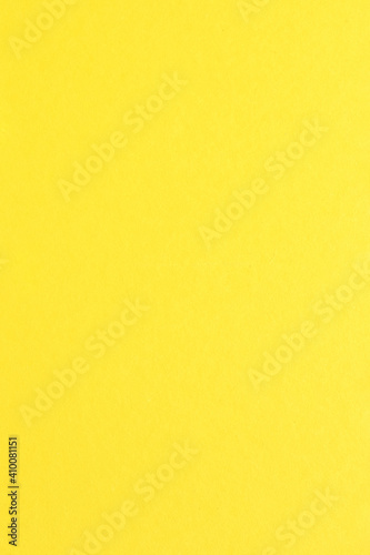 Yellow color paper background with simple surface.