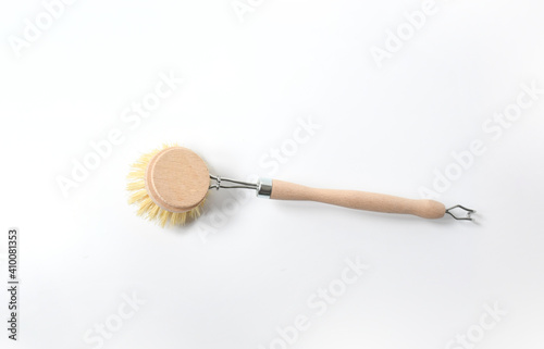 Wooden dish brush with bamboo wood and natural Bristle Tampico Fiber, on white background  . Item for cleaning in kitchen. photo