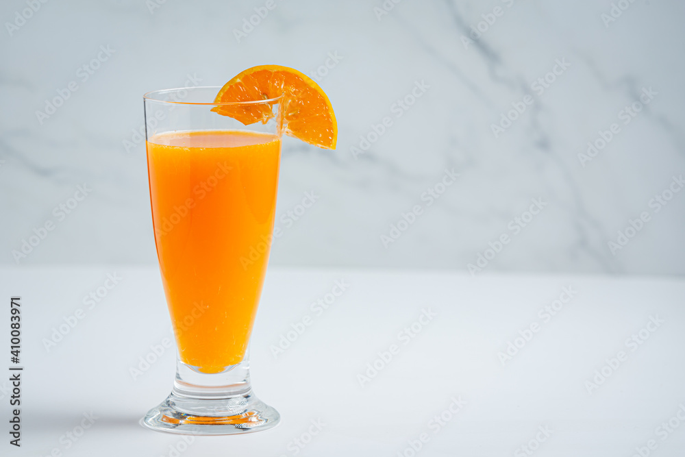 © artit - Fresh orange juice in the glass on marble background © artit - Fresh orange juice in the glass on marble background