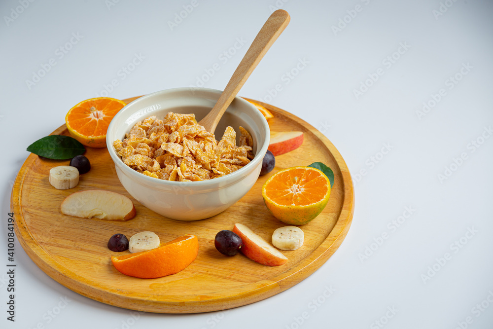 Cereal in bowl and mixed fruit on marble background Cereal in bowl and mixed fruit on marble background