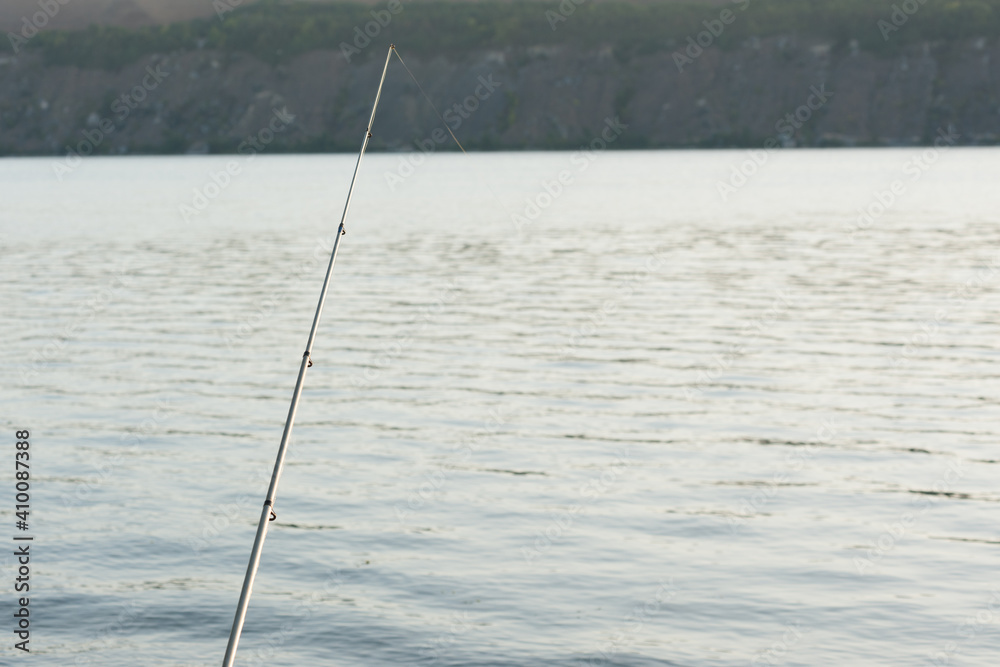 The part of fishing tackle on the background of the river The part of fishing tackle on the background of the river
