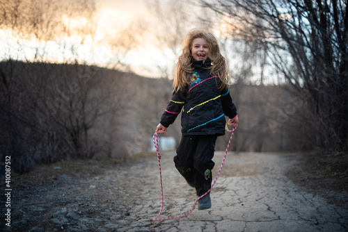 girl jump roap in spring outdoor sport activity