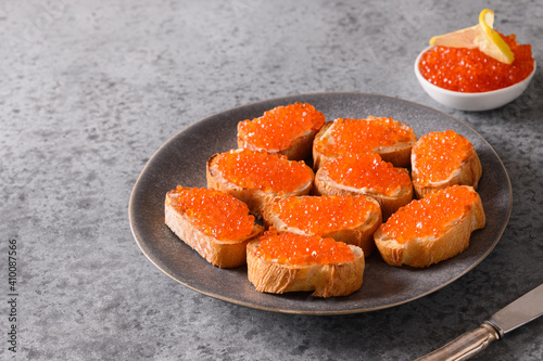 Canape with red caviar for party. Close up.