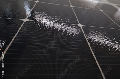 Flat surface of solar panels. Close-up square cells receiving sunlight