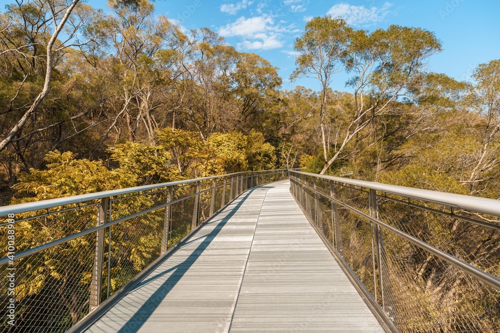 Diminishing Perspective View Of Empty Overpass with metal fence on the mountain