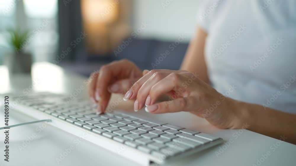 Female hands typing on a computer keyboard. Concept of remote work.