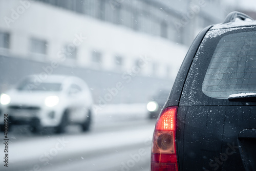 Close-up of a car in the snow in a winter city