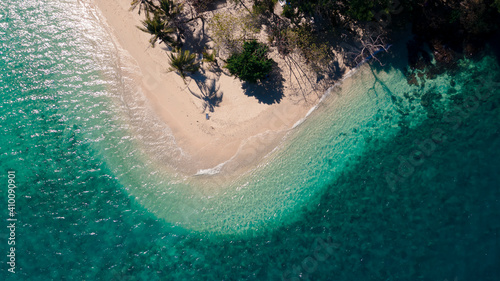 top view of mixed clear green blue sea waving on curve beach island, Rayang island beach, travel destination in Trat, Thailand
